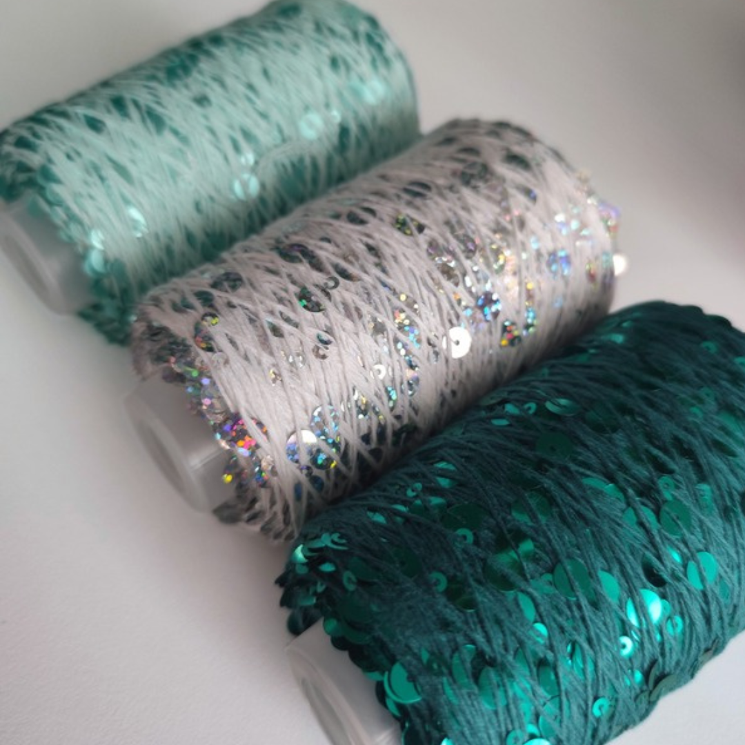 Filato Disco Diva con paillettes nei colori menta, bianco e acqua